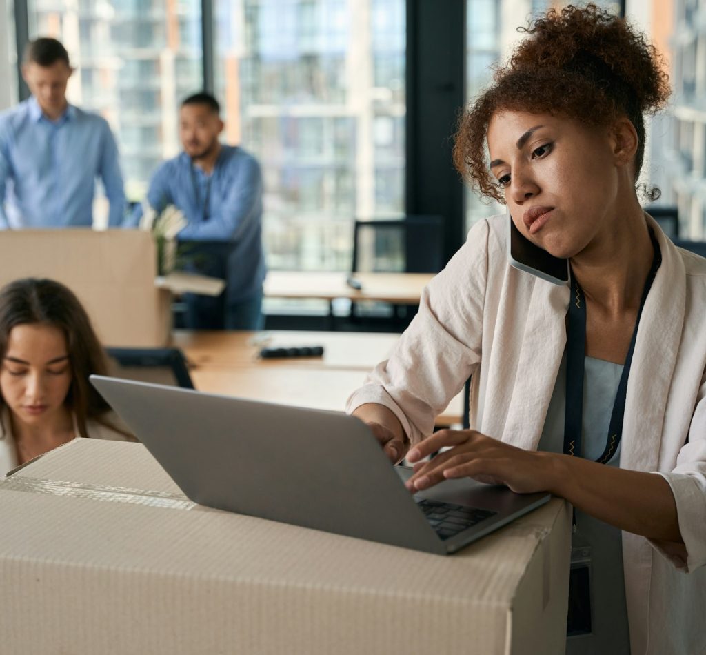 Group of corporate employees conducting office relocation