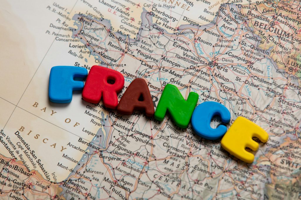 photo of map of France and colorful letters on the wonderful background