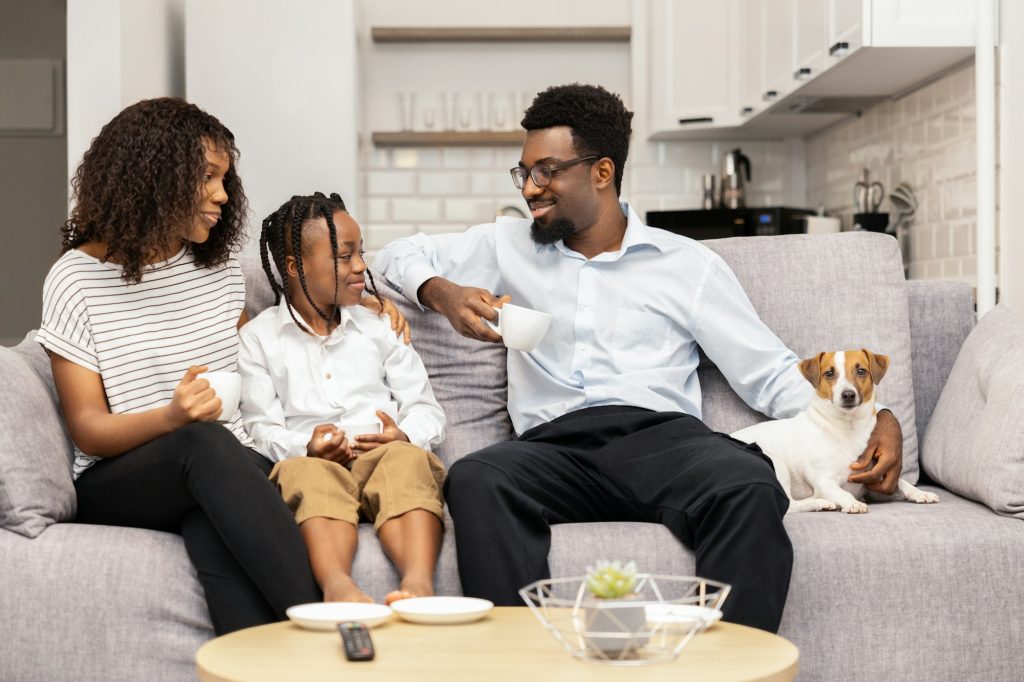 Happy African American Family Enjoying Time Together At Home
